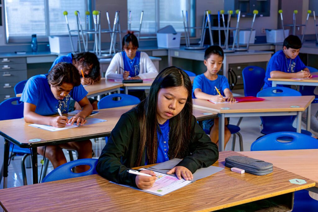 Students at their desks taking an exam