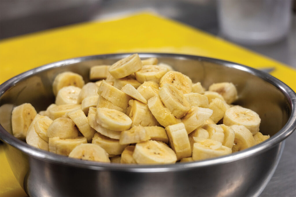 Local apple bananas cut in a bowl