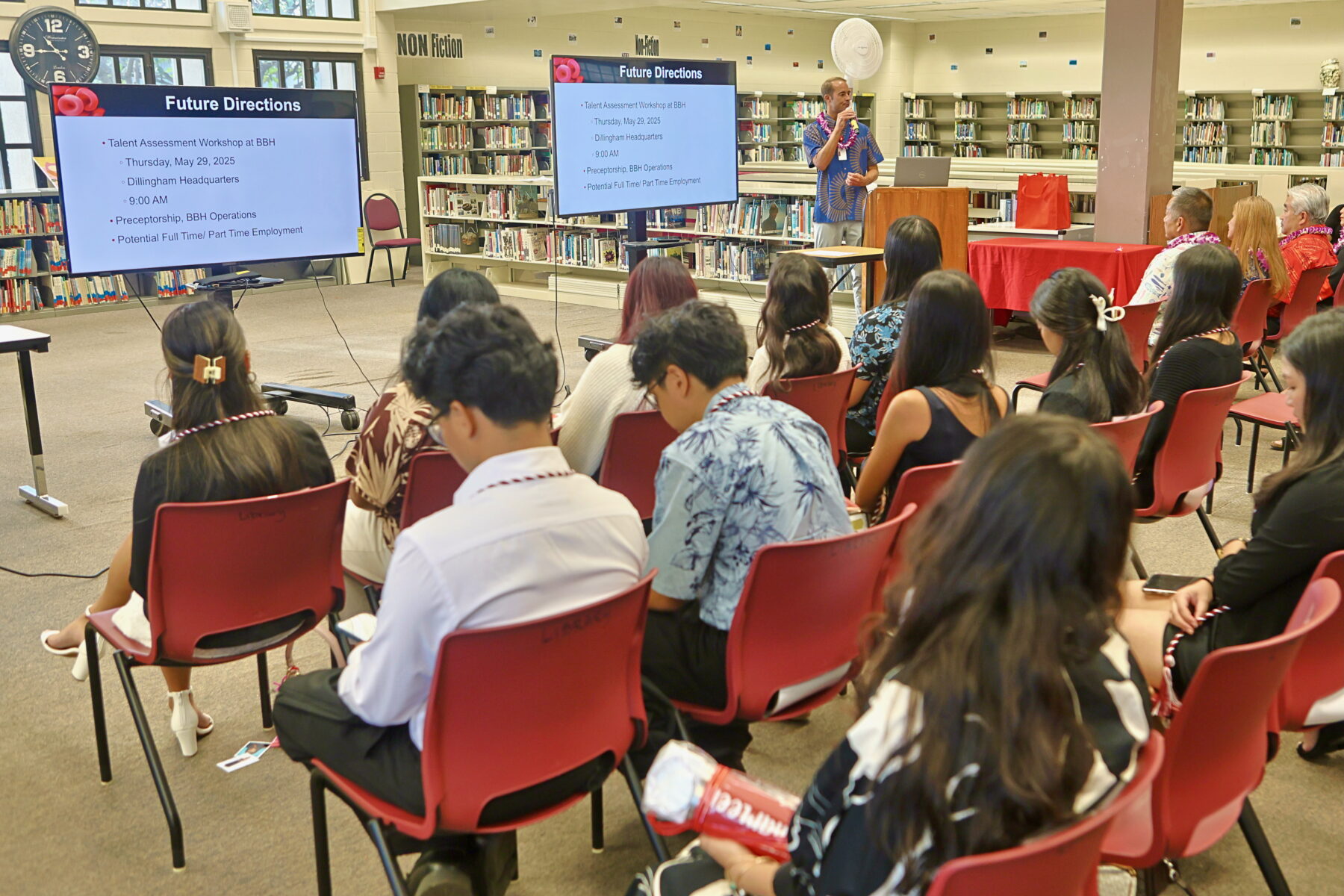 Photo of Nicholas Perih, Blood Bank of Hawaii Director of Recruitment & Community Relations, giving the Phlebotomy Training Program graduates guidance on possible hiring and careers.