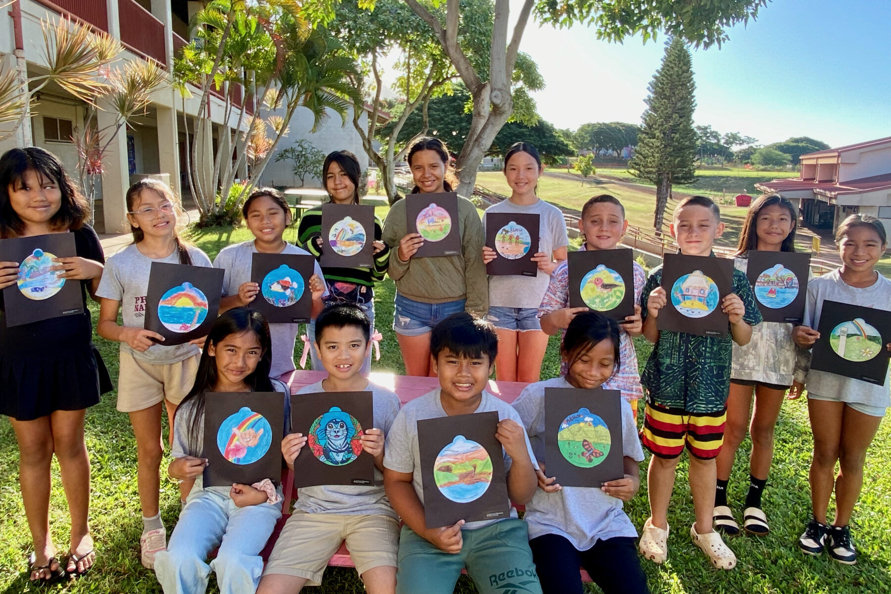 Photo of Princess Nāhiʻenaʻena Elementary students with their ornament designs for the 2025 National Christmas Tree Lighting.