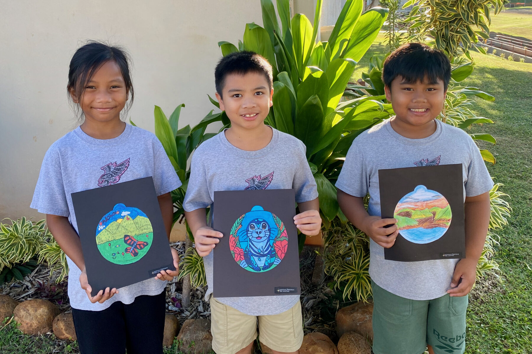 Photo of Princess Nāhiʻenaʻena Elementary students with their ornament designs for the 2025 National Christmas Tree Lighting.