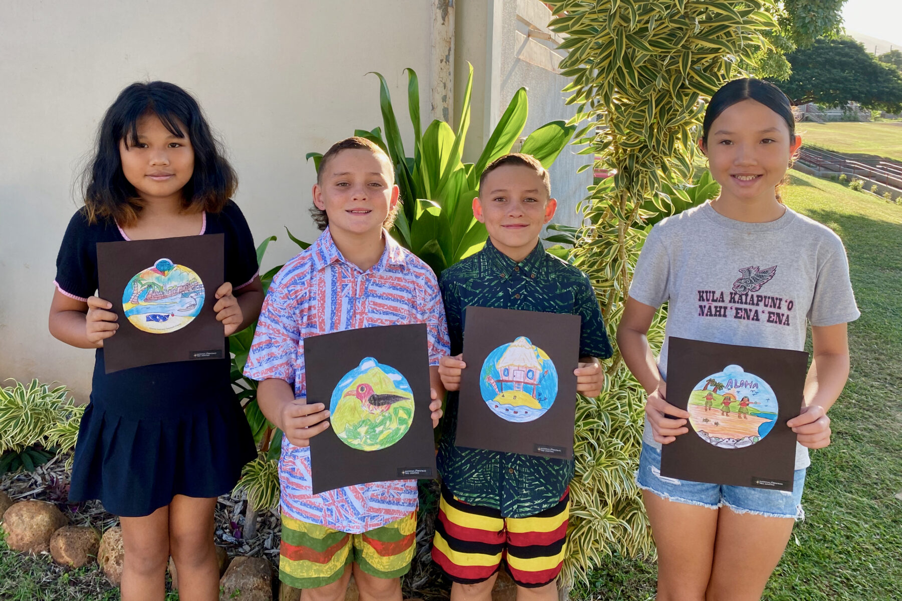 Photo of Princess Nāhiʻenaʻena Elementary students with their ornament designs for the 2025 National Christmas Tree Lighting.
