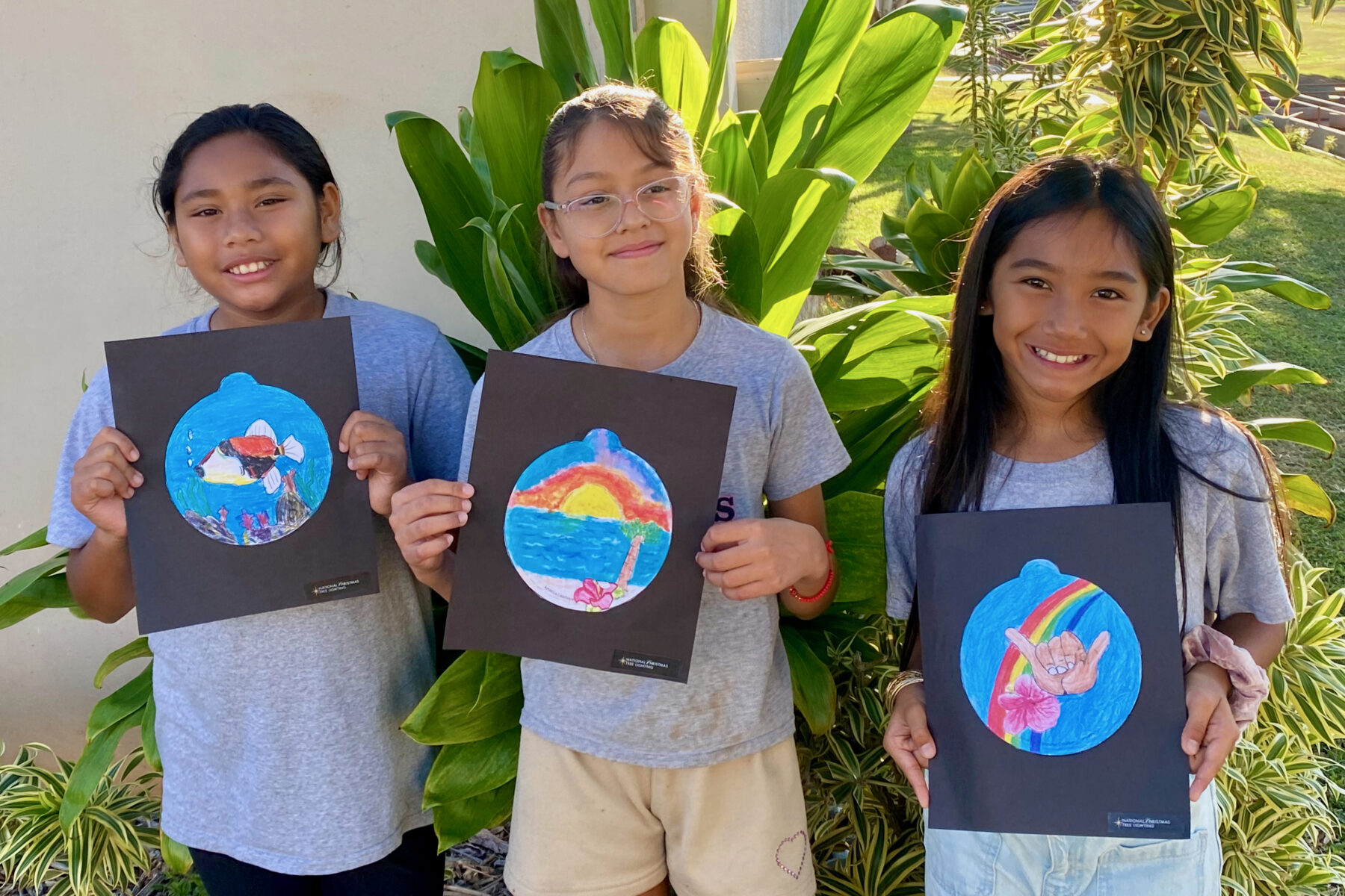 Photo of Princess Nāhiʻenaʻena Elementary students with their ornament designs for the 2025 National Christmas Tree Lighting.