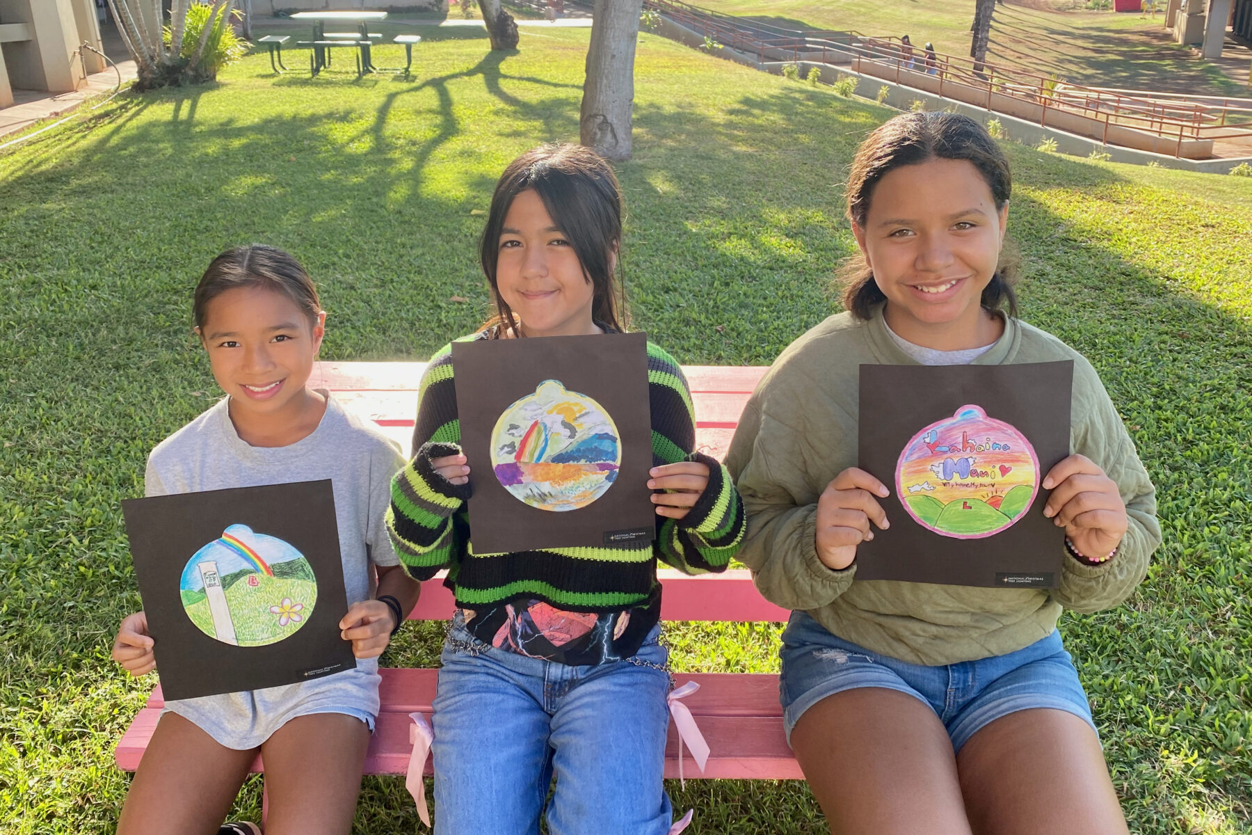 Photo of Princess Nāhiʻenaʻena Elementary students with their ornament designs for the 2025 National Christmas Tree Lighting.