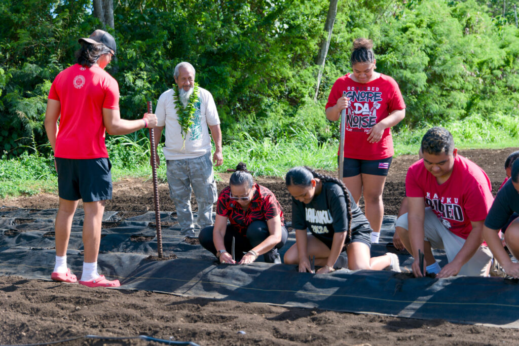 Kahuku High students and teacher in garden