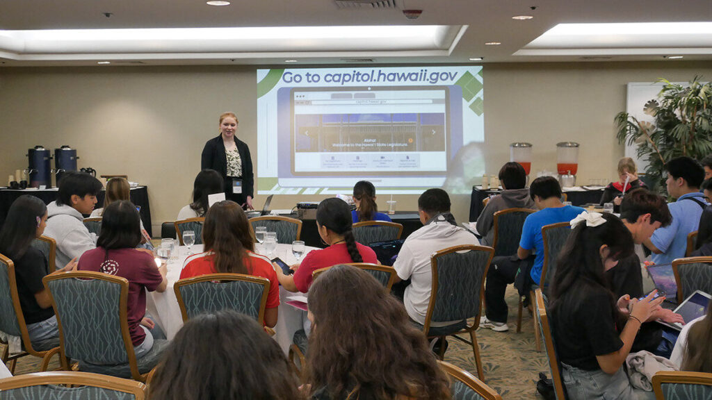 Secondary Student Conference attendees listen during a session.