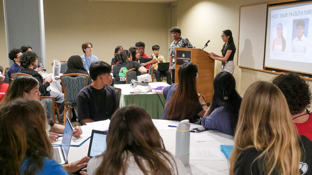 Secondary Student Conference attendees listen during a session.
