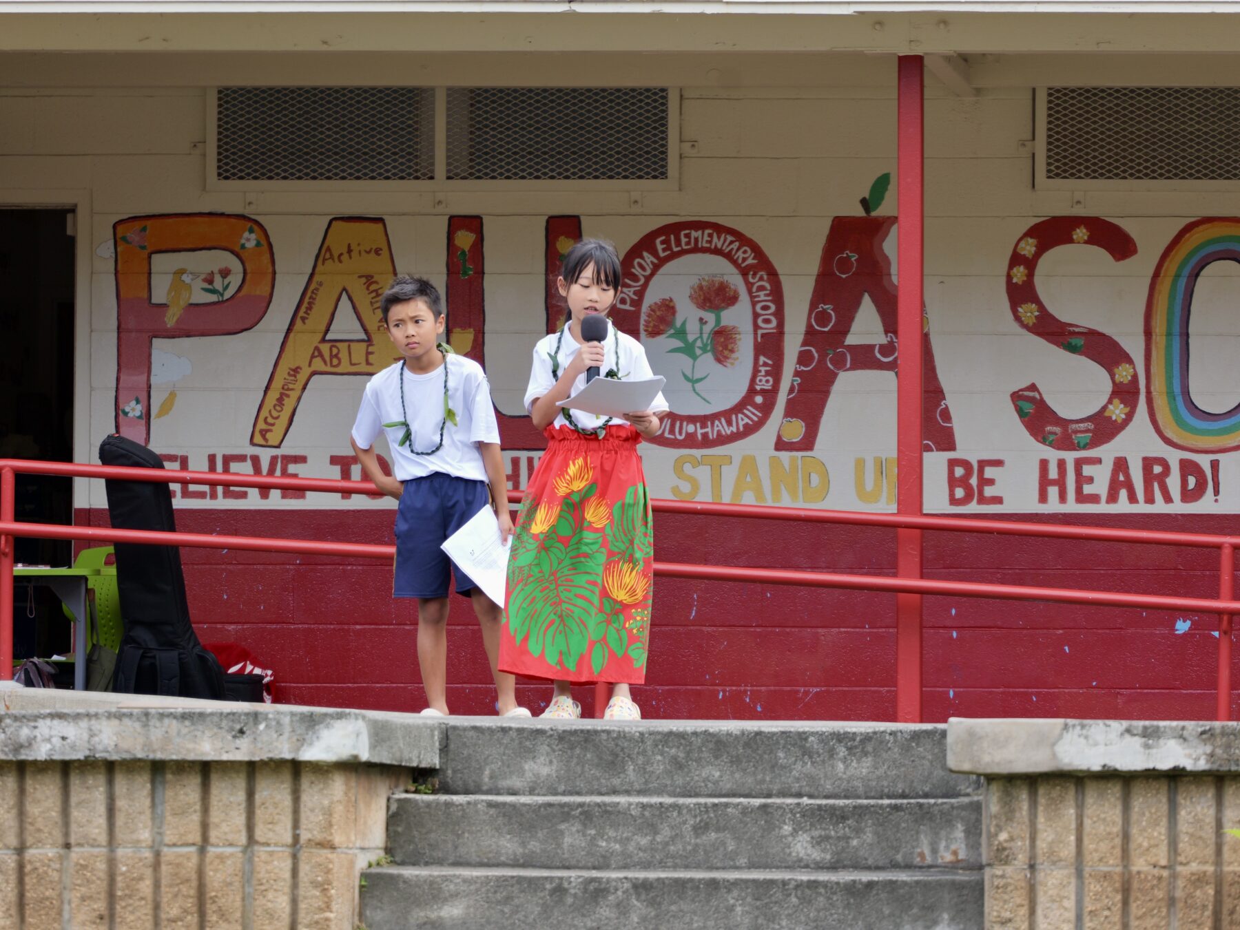 Students speak during a ceremony at Pauoa Elementary School.