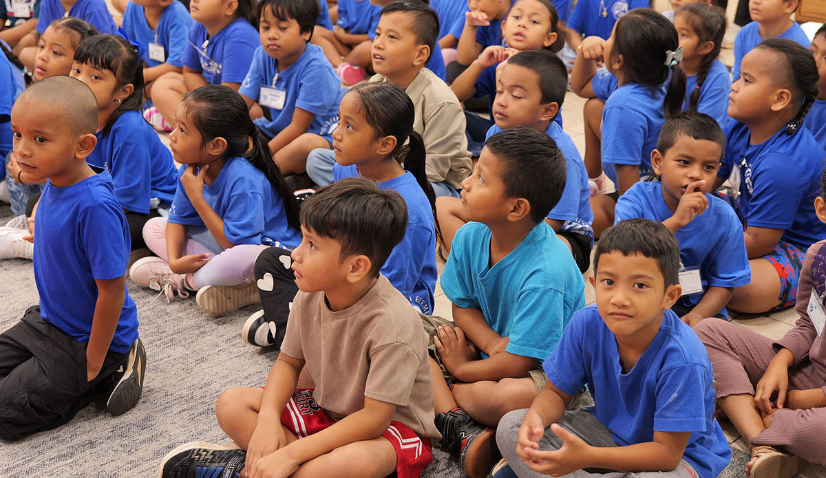 Linapuni Elementary School students listen to a story.