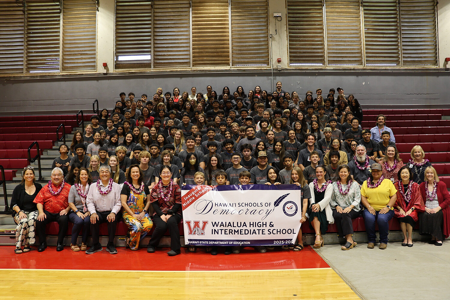 Waialua students and staff with the Hawai‘i Schools for Democracy banner.