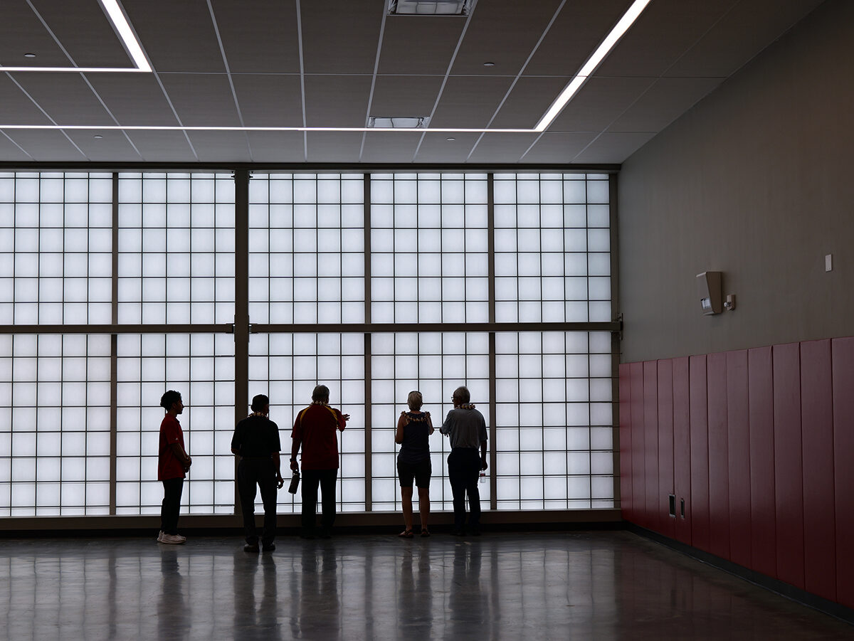 A Roosevelt basketball player showed guests the new mat room in the gym.
