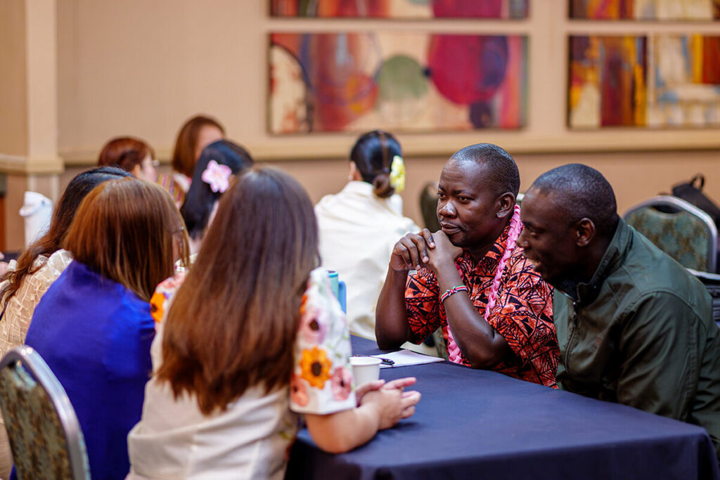 Members of the latest cohort of the J-1 Visa Teacher Program chat with each other.