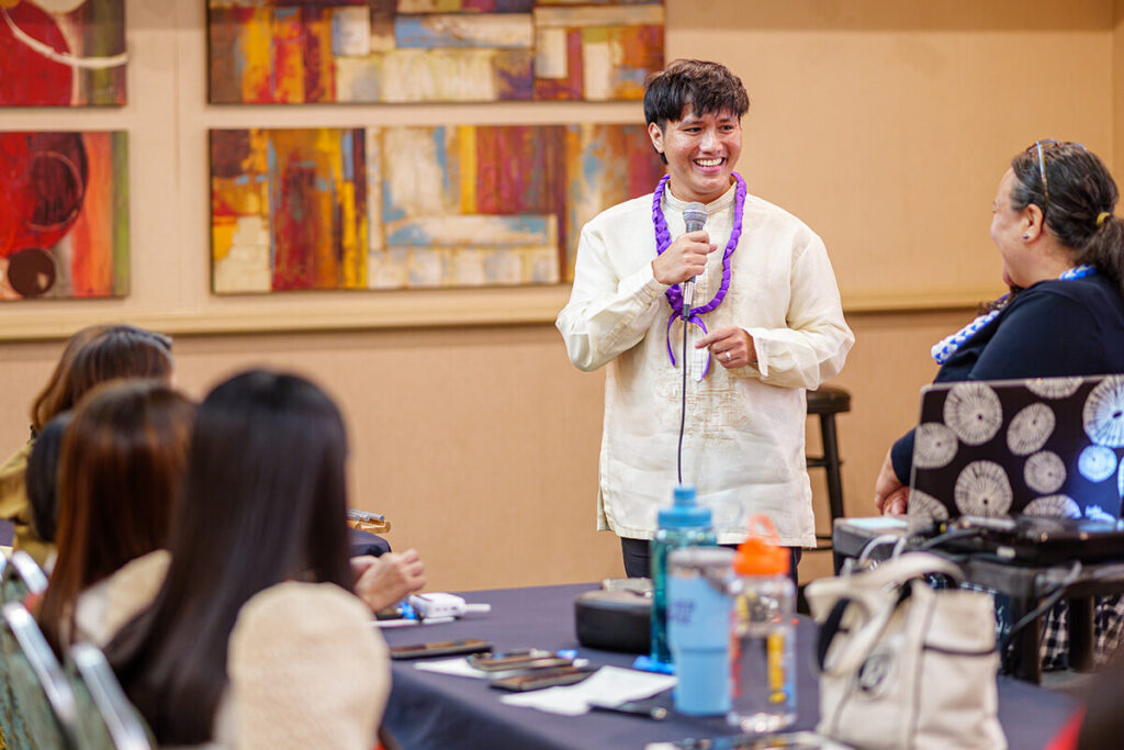 A member of the latest cohort of the J-1 Visa Teacher Program speaks to other cohort members.