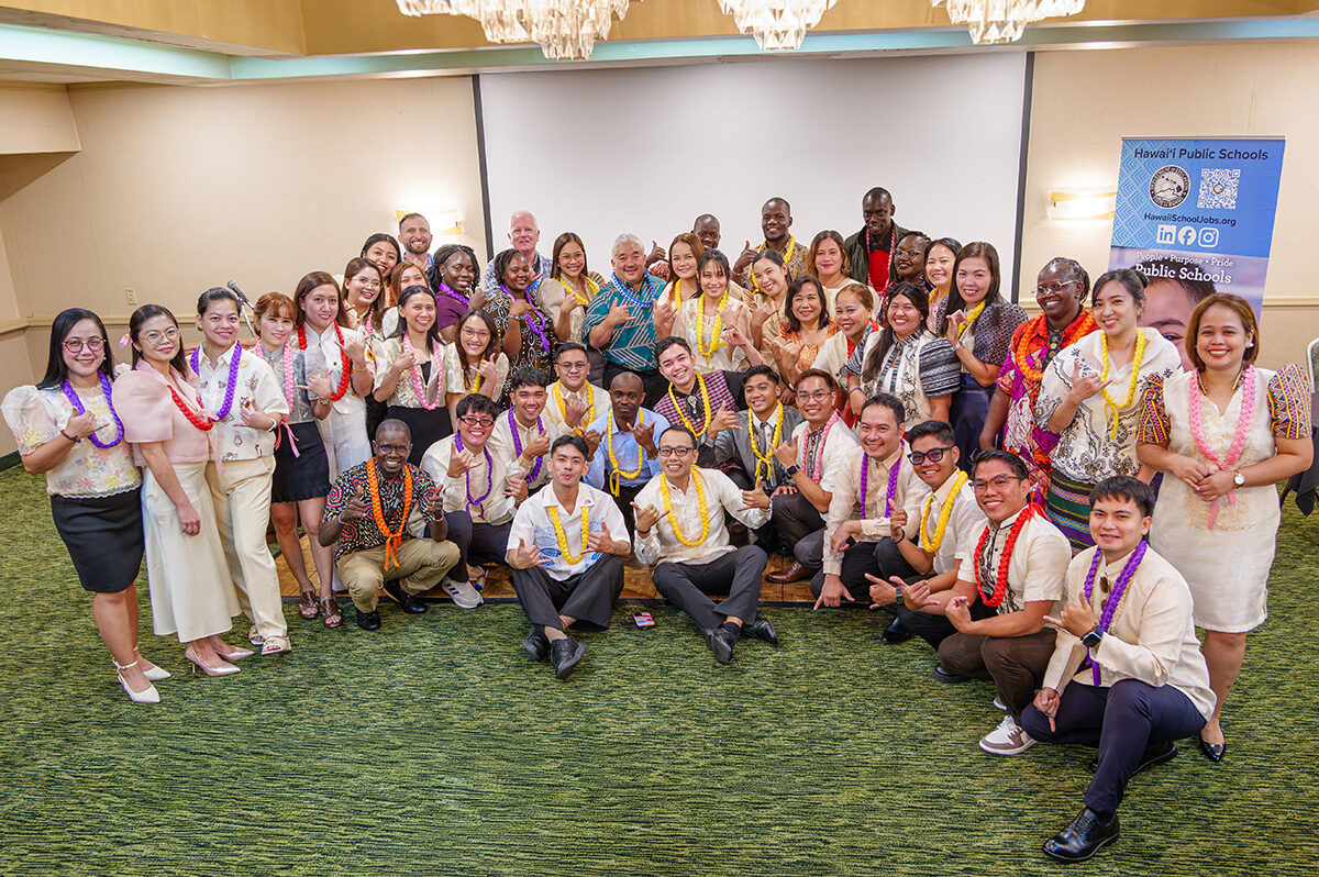 Superintendent Keith Hayashi takes a photo with the latest cohort of the J-1 Visa Teacher Program.