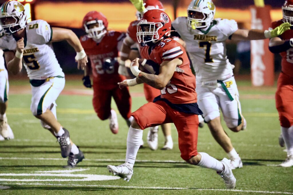 Football player runs with ball