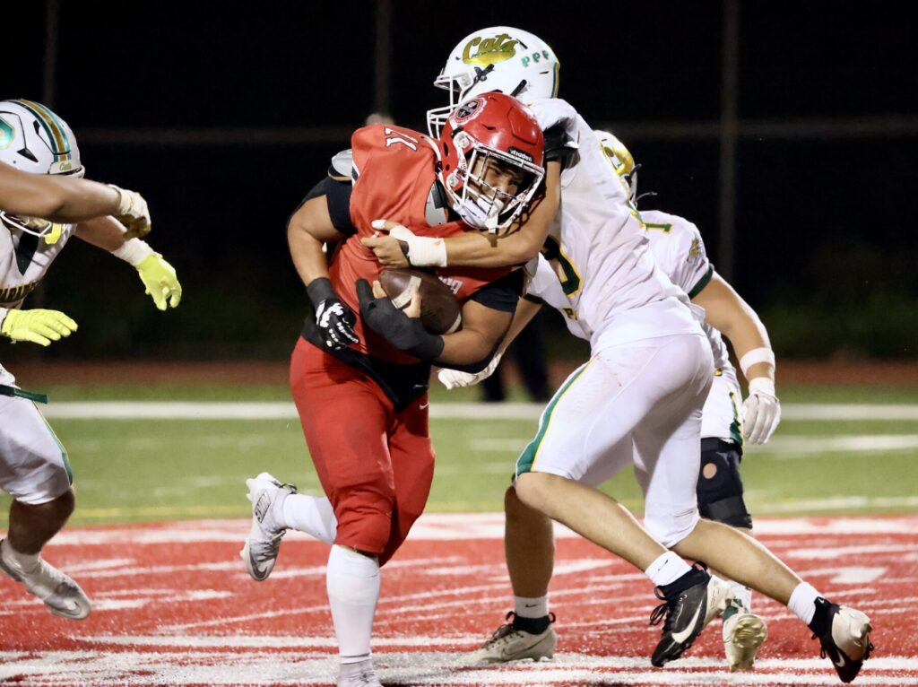 Football player runs with ball