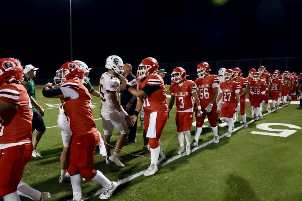 Football players shake hands