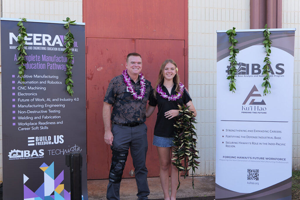 Mililani High Principal Fred Murphy and a student stand during the blessing ceremony.