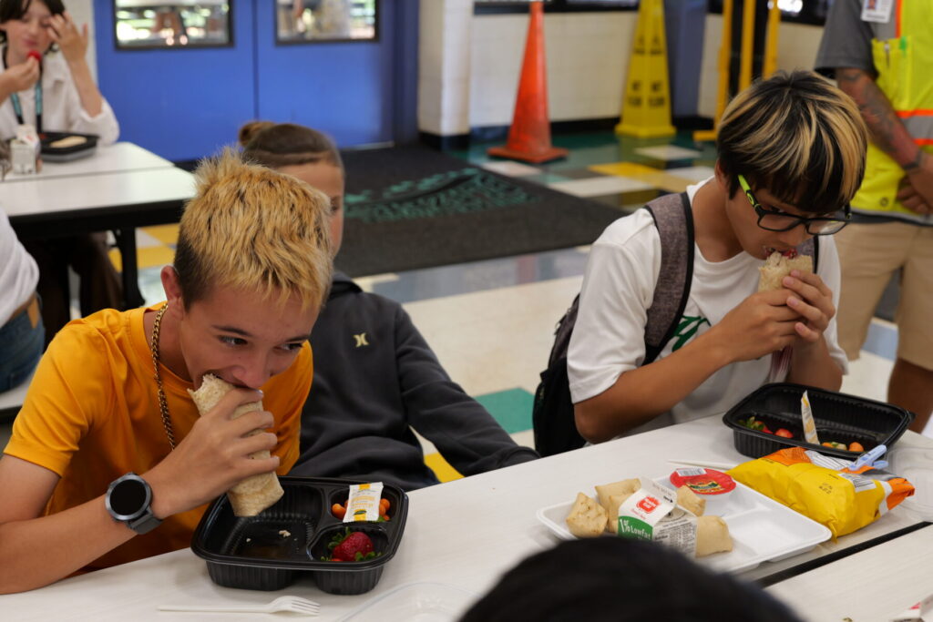 Students eating chicken wraps