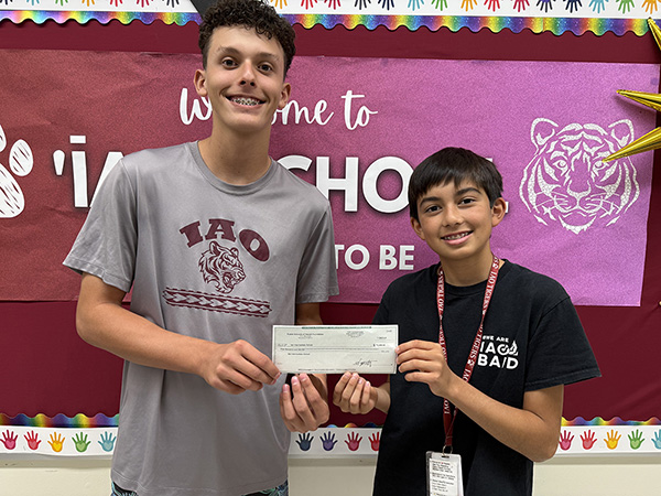 ʻĪao Intermediate students held their prize from the Design Intelligence Lab contest.