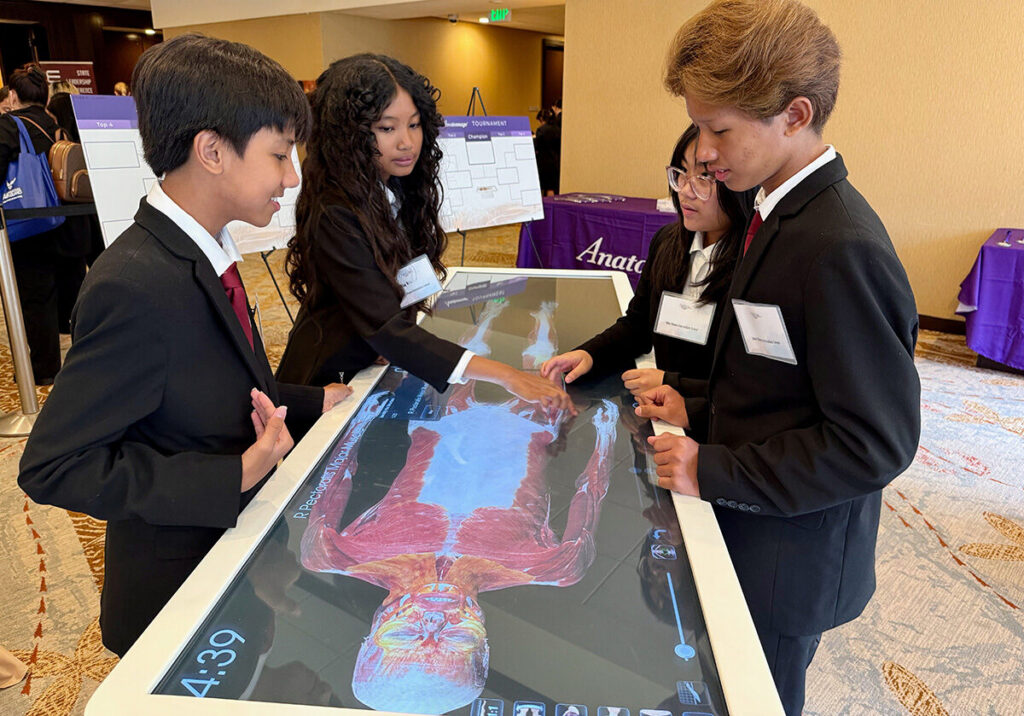 Students work on the Anatomage Table during their CTSO event.
