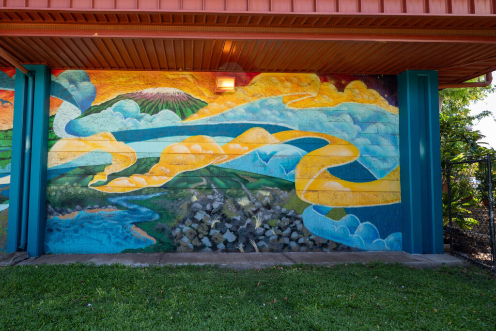 Waikoloa mural with golden clouds