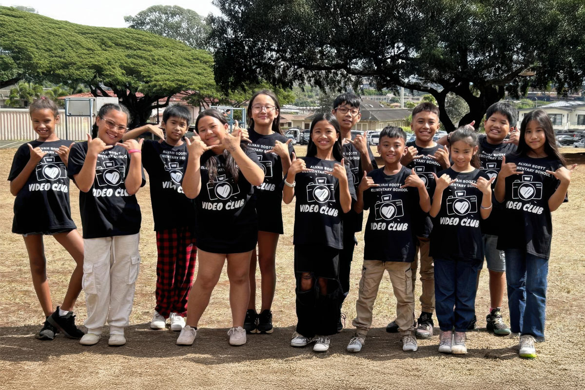 Group of video club students outside smiling for a photo