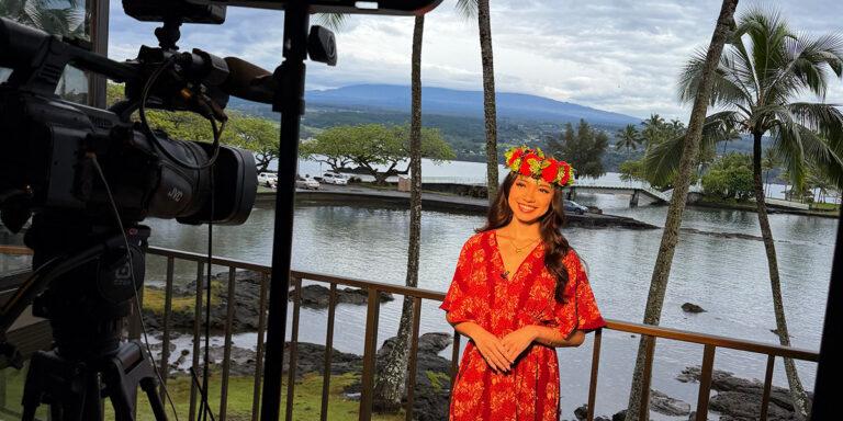 Woman stands in front of camera