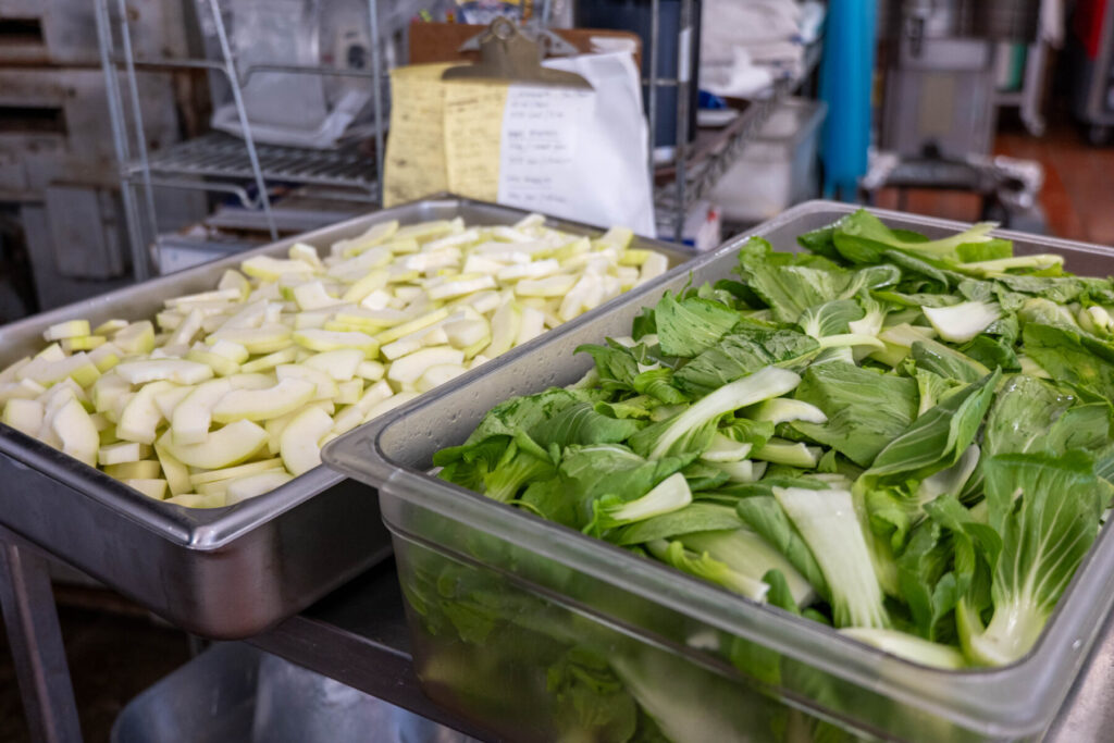 Locally sourced green papaya and bok choy