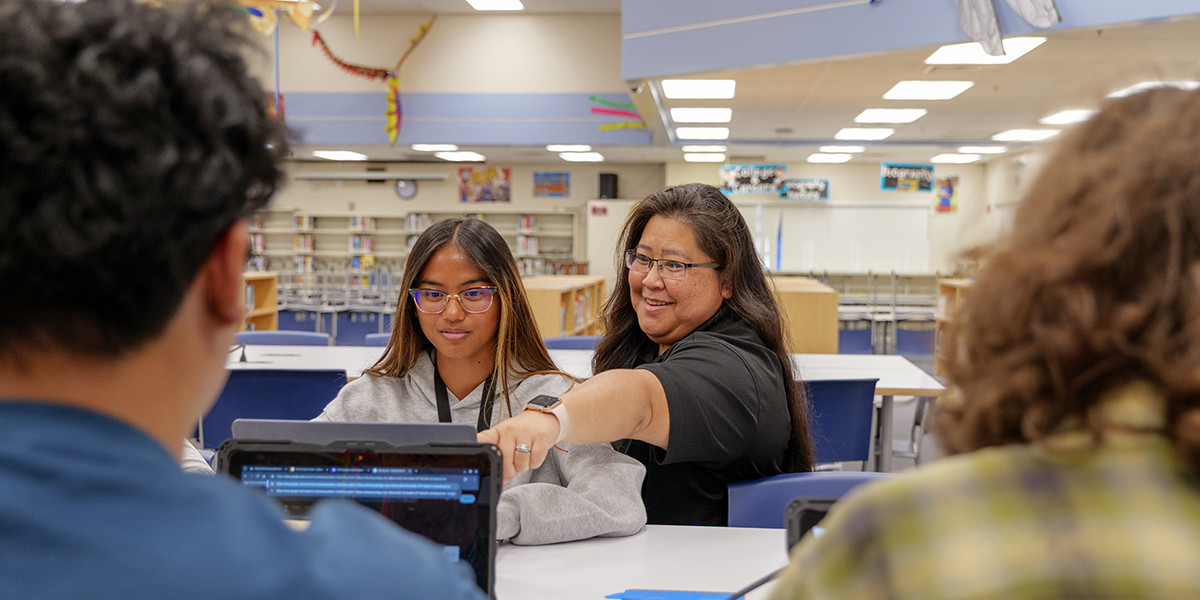 Teacher points to computer
