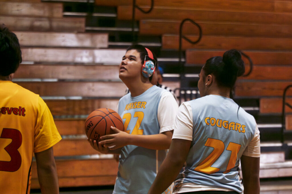 Student looks to shoot basketball