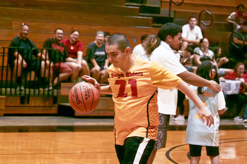 Student dribbles basketball