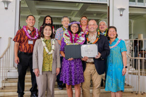 Kris Tajima receives her award.