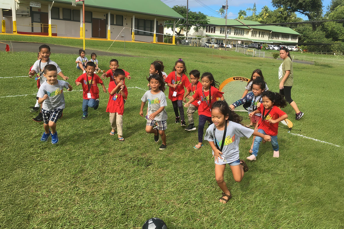 students playing soccer