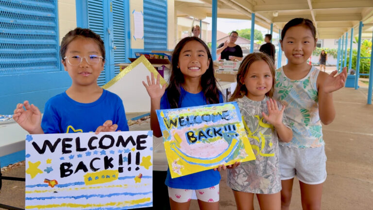 Hōkūlani Elementary students paint "Welcome Back" artwork to celebrate the start of the new school year.