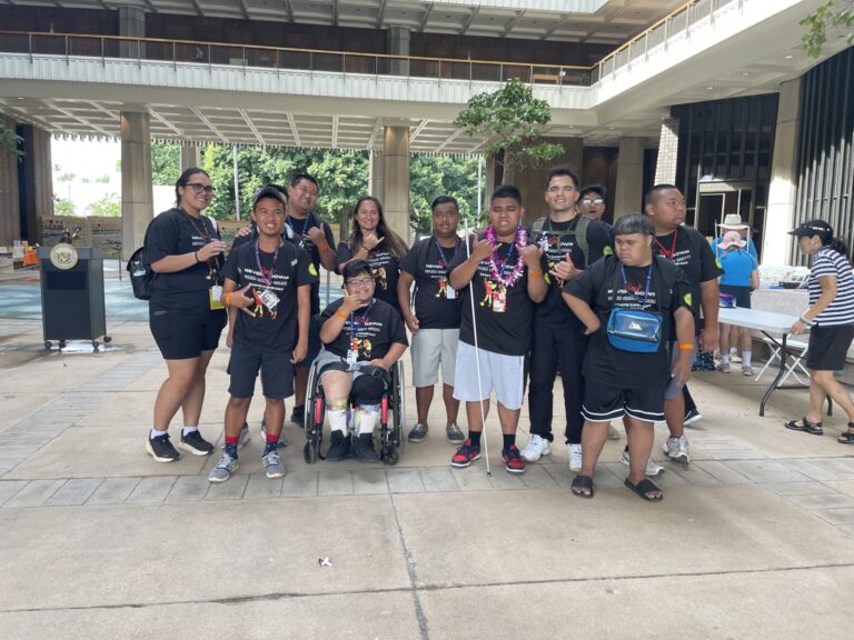 Students wear a shirt that says "Never back down" designed by Waipahu High School student Jayzen Carlos