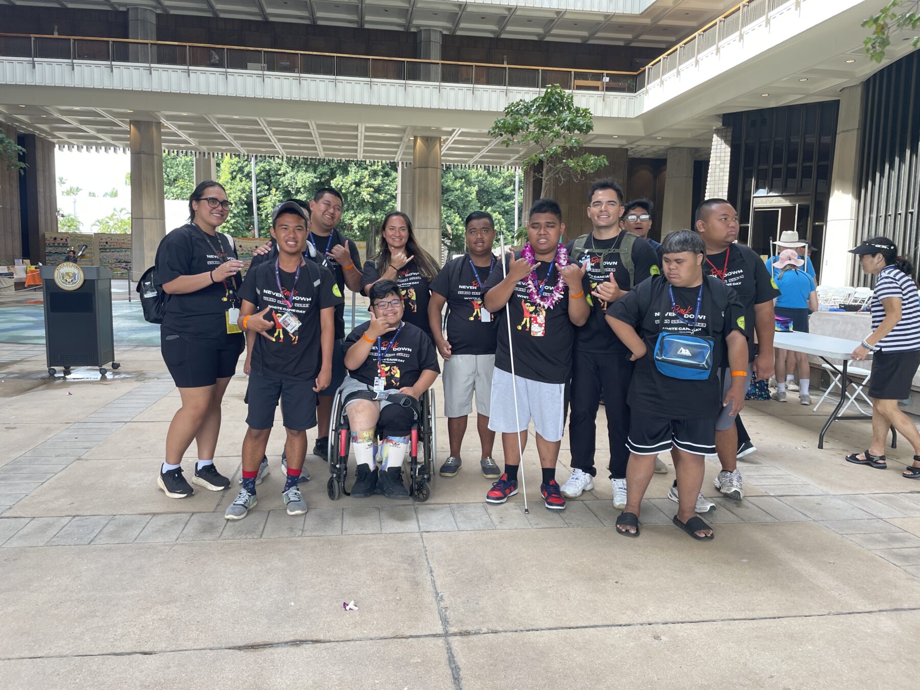Students wear a shirt that says "Never back down" designed by Waipahu High School student Jayzen Carlos
