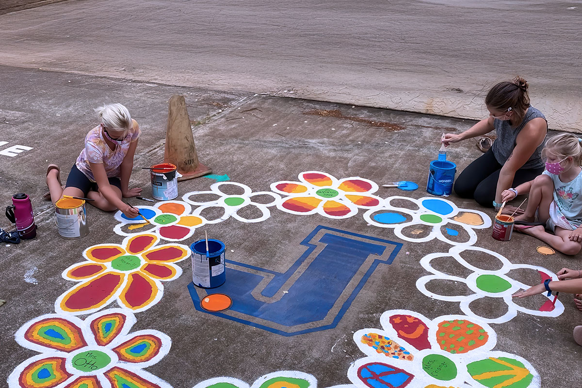 staff and students painting