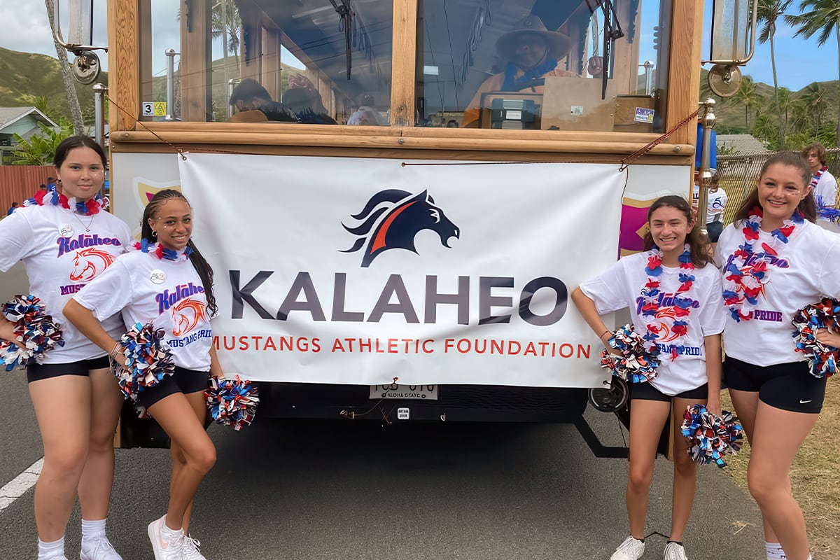 cheerleaders in front of trolley