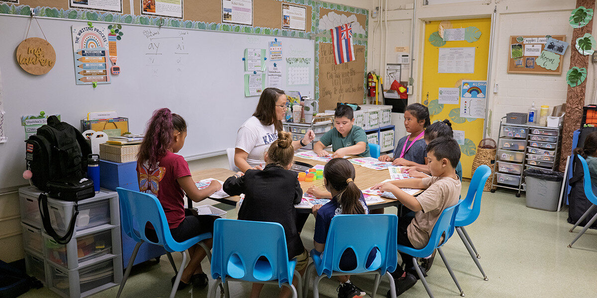Students sitting at desks in a classroom
