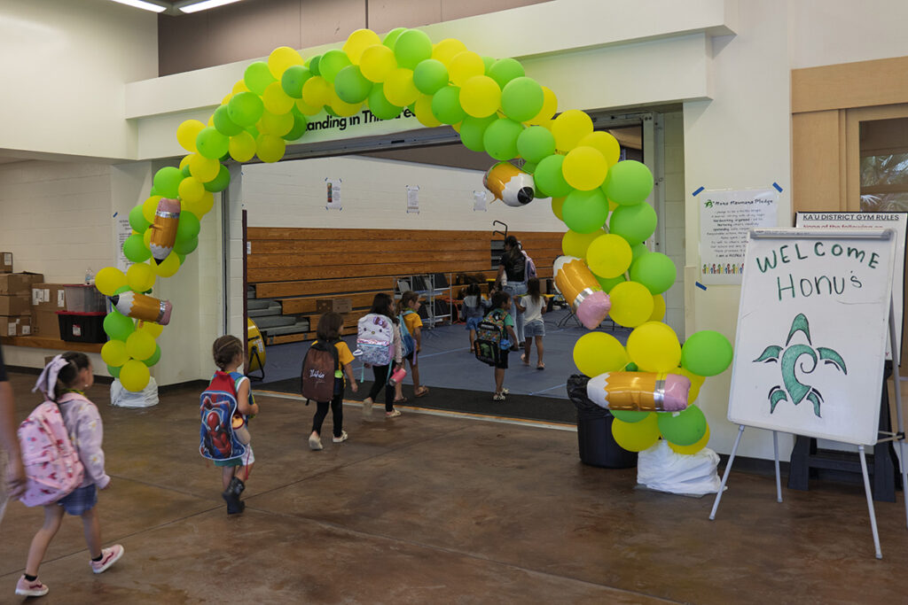 Nā‘ālehu students walk into Ka‘ū District Gym.