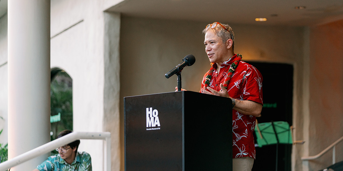 Man speaks at podium