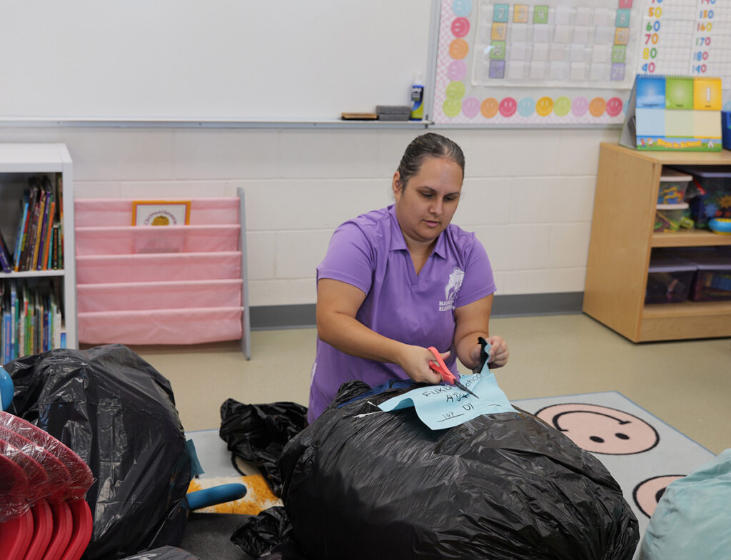 First-grade teacher Nanea Fukuda unpacks supplies in her new classroom.