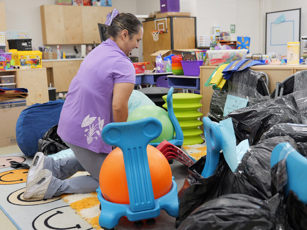 First-grade teacher Nanea Fukuda unpacks supplies in her new classroom.