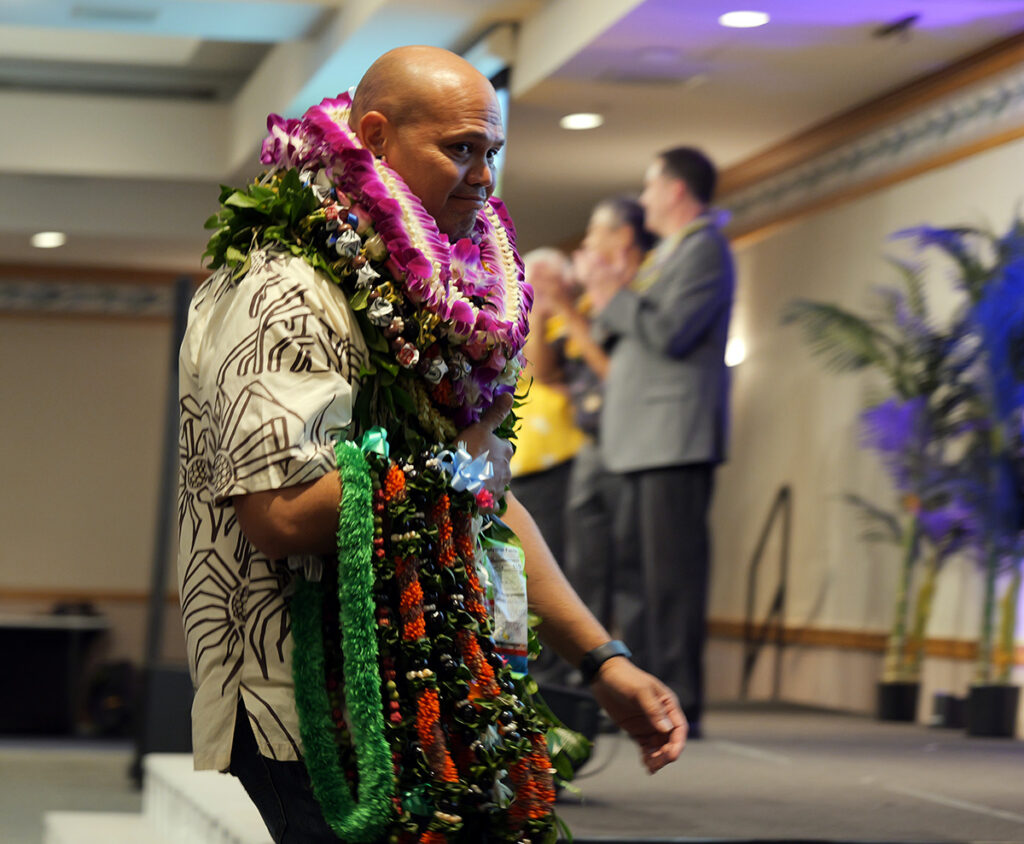 ‘Aiea High School teacher Shawn-Patrick Kalani walks to the stage to receive his award.