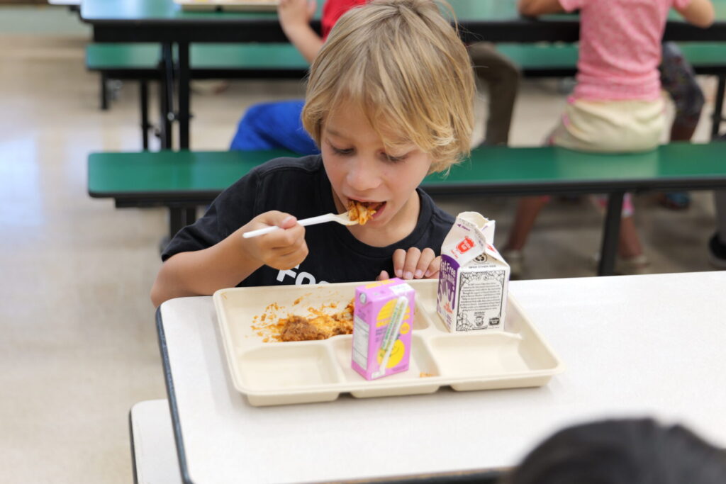 Student eating lunch featuring local beef.