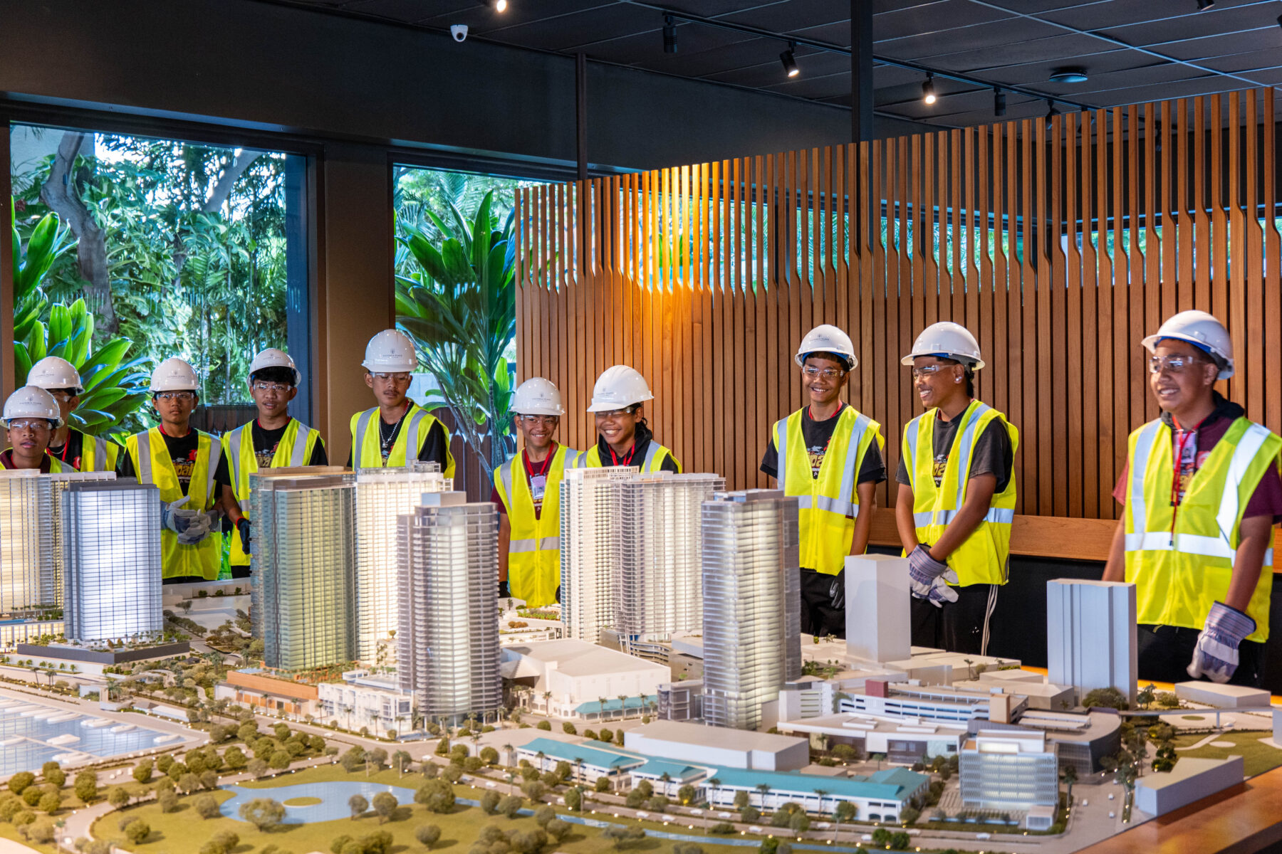 Ten students behind scale model of Ward Village